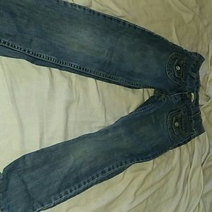 Rolled up jean for kids with red thread at the top